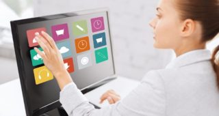 businesswoman with computer touchscreen in office