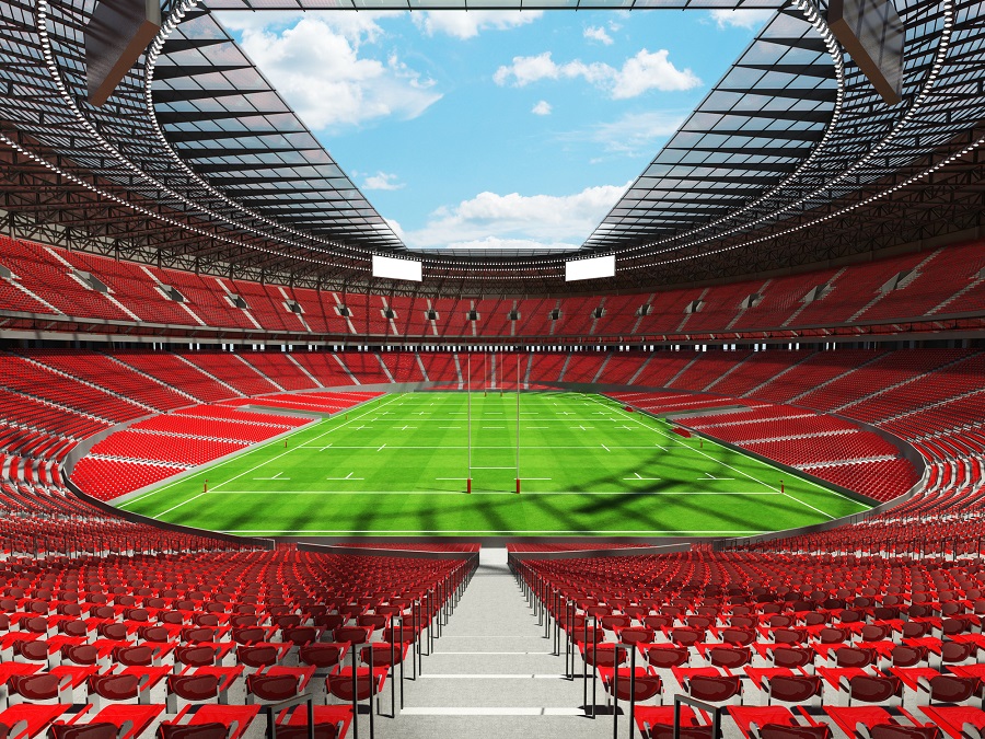 3D render of a round rugby stadium with  red seats and VIP boxes